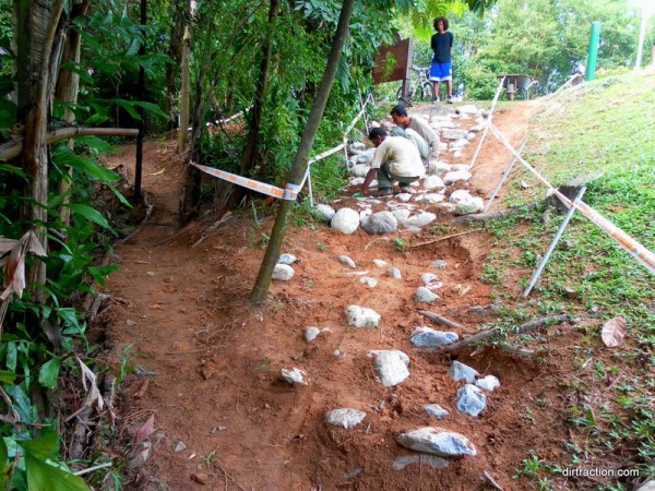 stuffing soil into the cracks, this is 3hours after we get the load of rocks in, good to work in groups of 4.